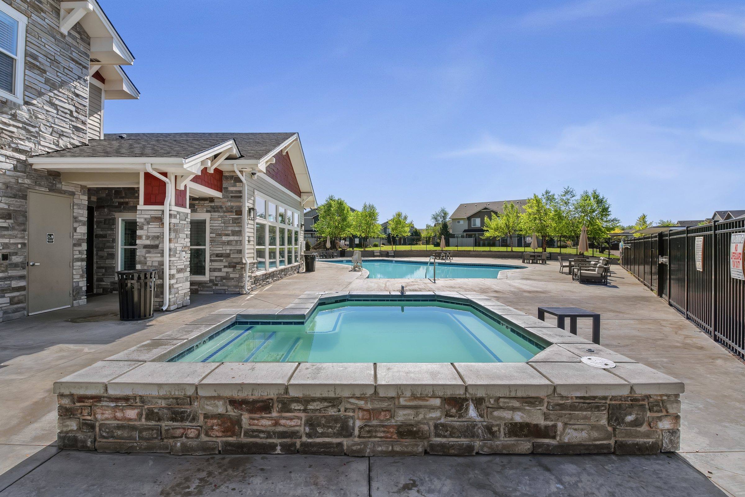 The resort-style pool beside the clubhouse at The Enclave