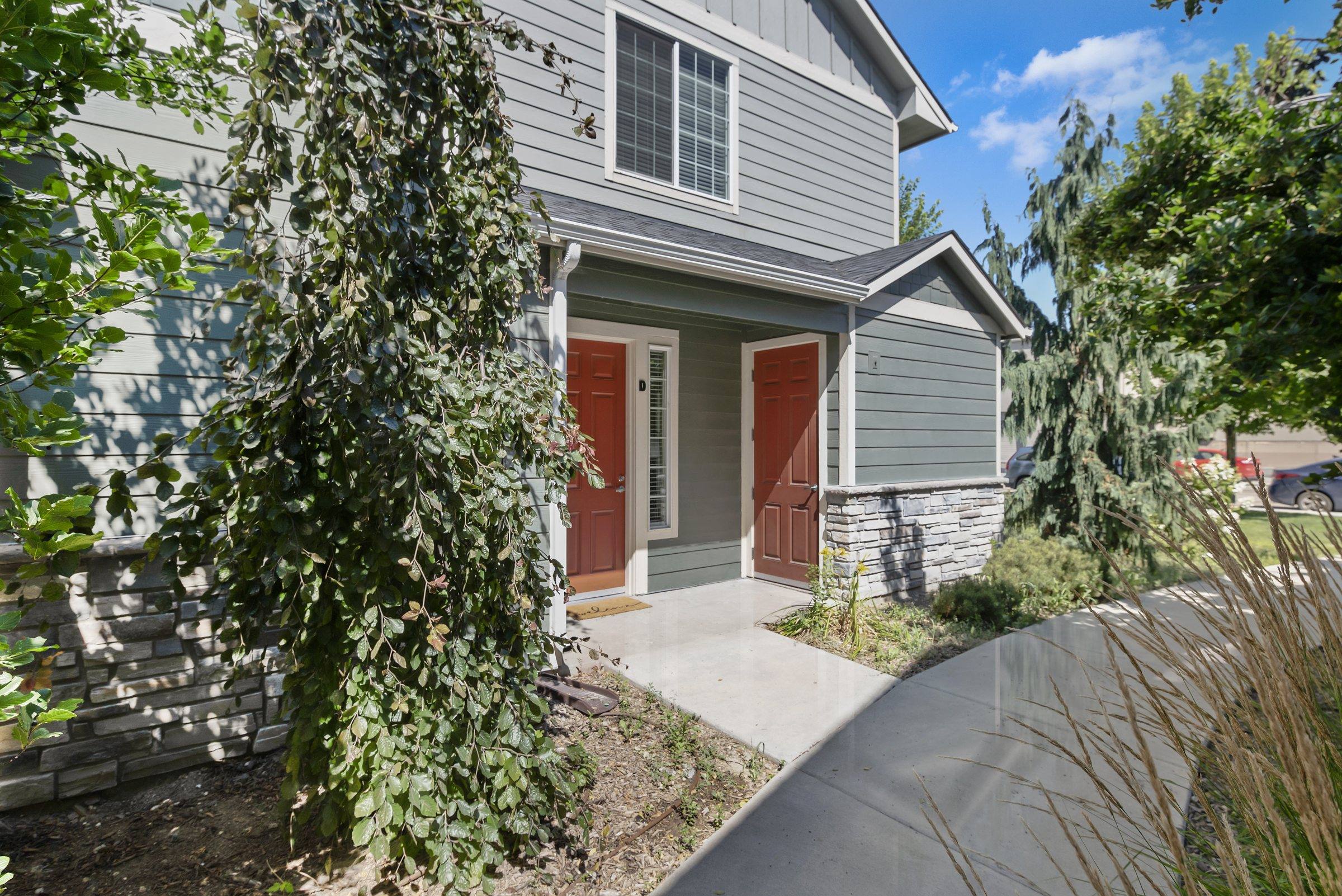 Townhome building exterior with craftsman detailing and private entries