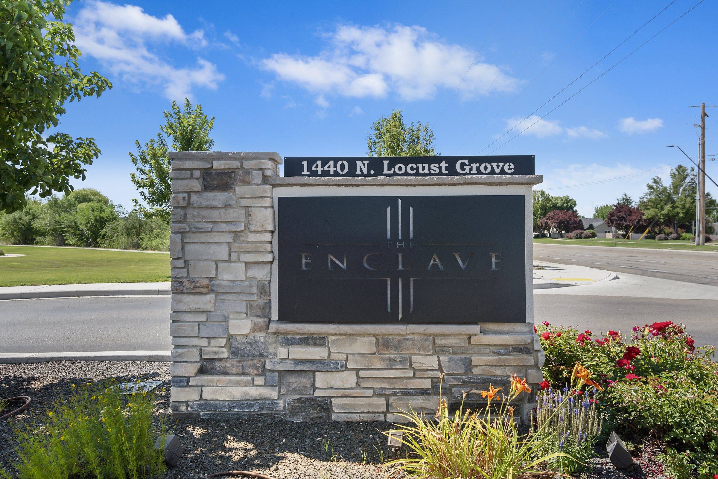 The Enclave monument sign at the property entrance on Locust Grove